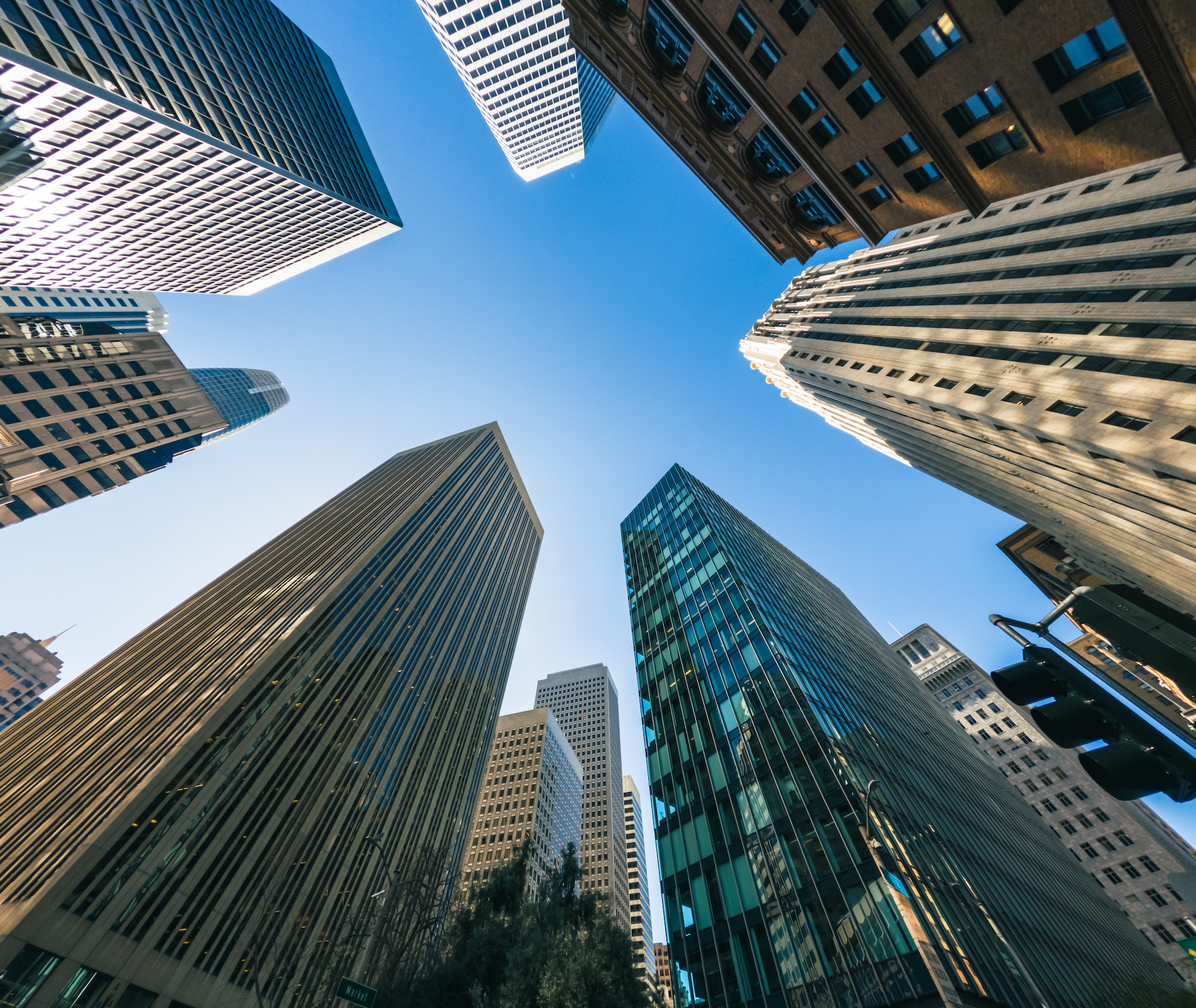 View of SF financial district skyscrapers from the group looking up as buildings tower overhead