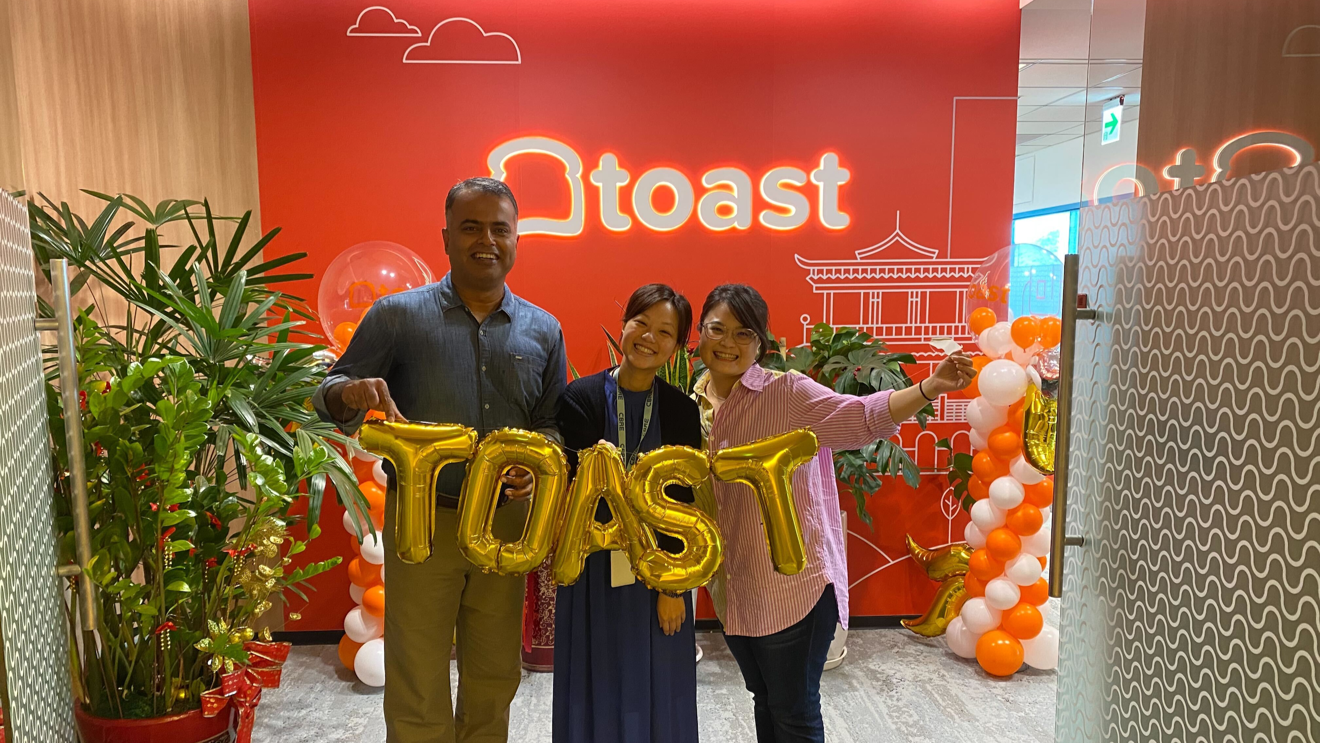 Three Toasters in the company’s Taipei, Taiwan, office hold a string of balloon letters spelling out “Toast.”