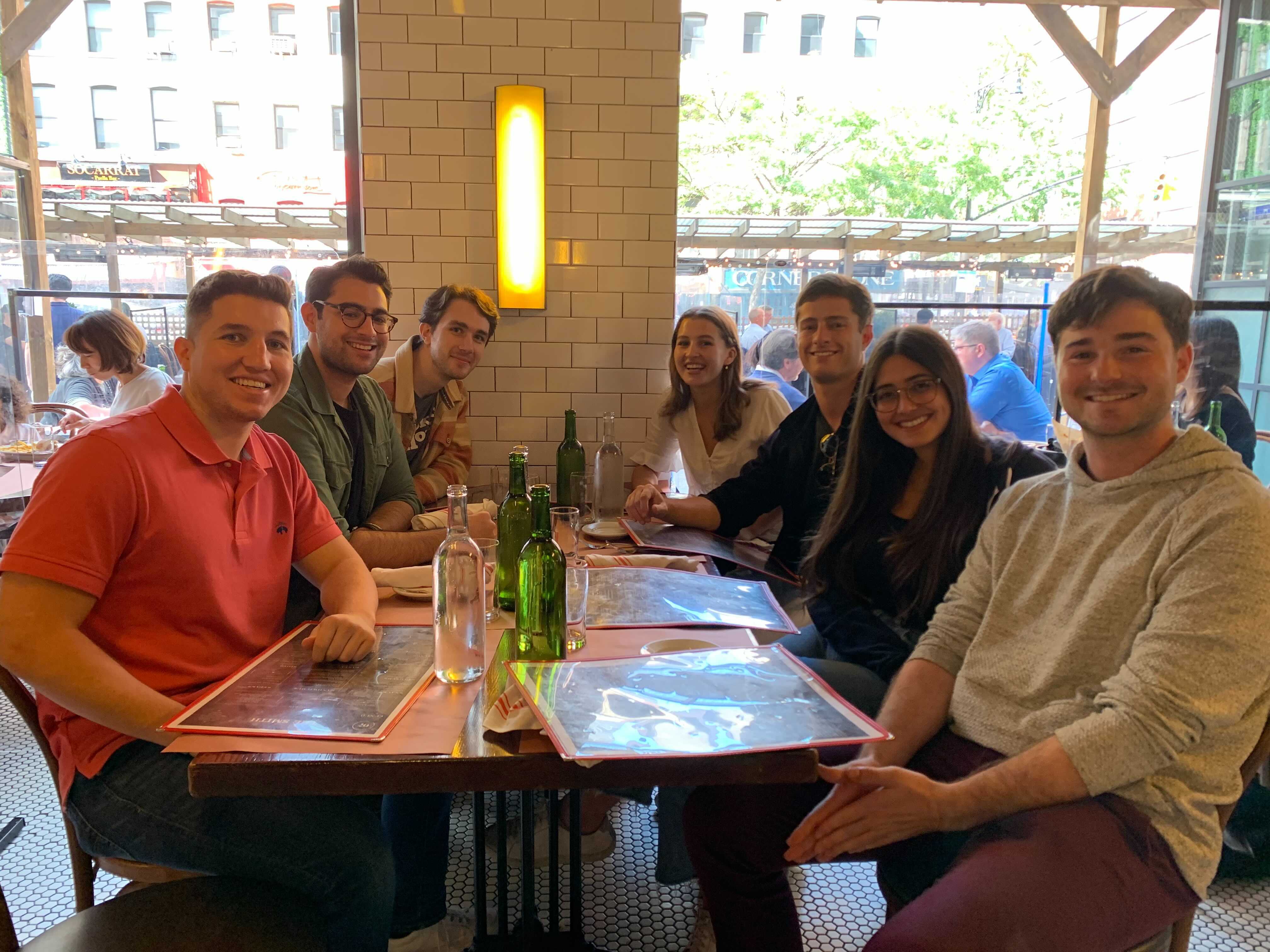 A group of Ontra employees together at a restaurant.