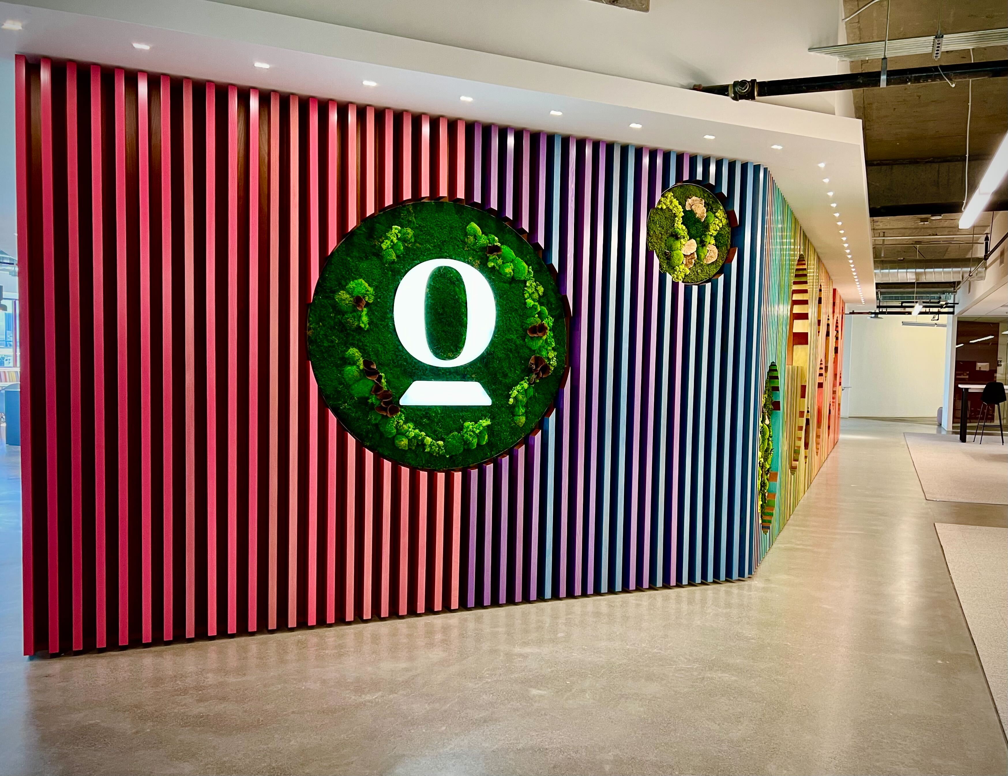 An image of a colorfully slatted logo wall at Opendoor’s offices. CAPTION: Opendoor